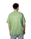 Drôle de Monsieur Le T-Shirt Slogan Calligraphy Light Green