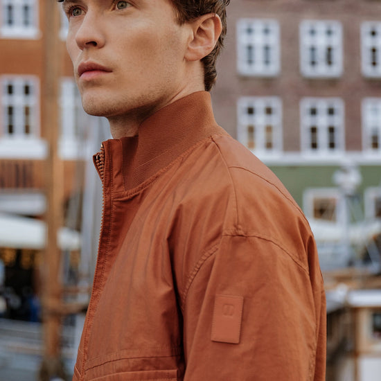 DUNO HELIO BOMBER ORANJE JAS CHECKPOINT