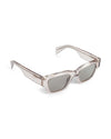 AY Studios Norse Transparent Sand zonnebril, schuin van voren met open veren