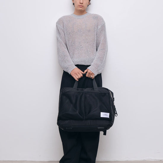 AY Studios Weekend Bag Black reistas, aan de handgrepen gedragen