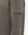 Genti groene trui met mouwzak, detail mouwzak