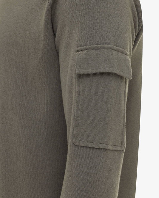 Genti groene trui met mouwzak, detail mouwzak