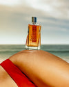 Morph Indomable 100 ml — flacon op een schouder bij het water