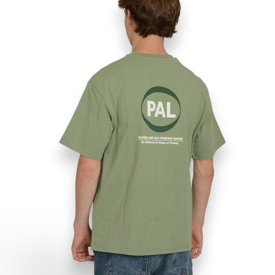 PAL Sporting Goods Pre Game T-shirt in Green, gedragen achteraanzicht met grote ronde PAL-print op de rug.