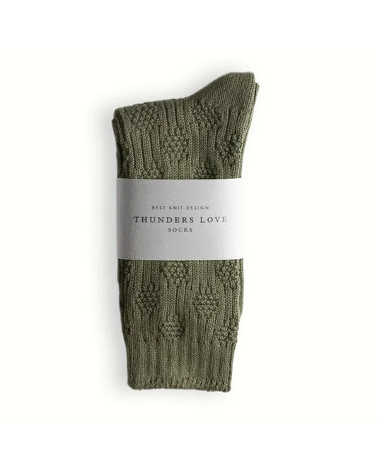 Thunders Love Link Duo Olive Green sokken gevouwen met papieren band en zichtbaar structuurpatroon